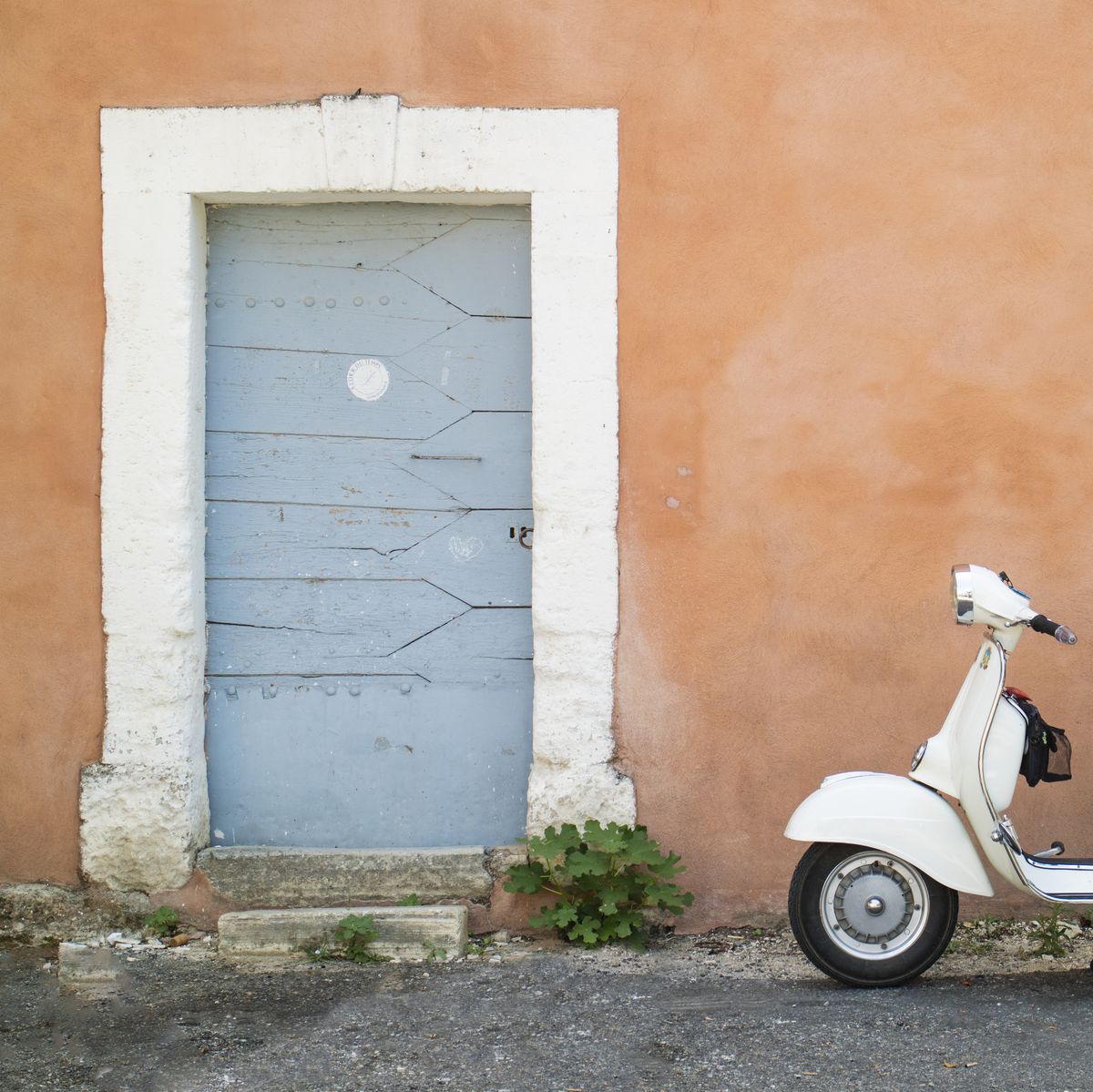 Scooter in doorway, Bonnieux in Provence, France
