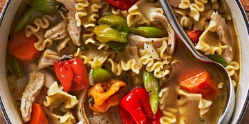 chicken soup with noodles and scotch bonnet peppers