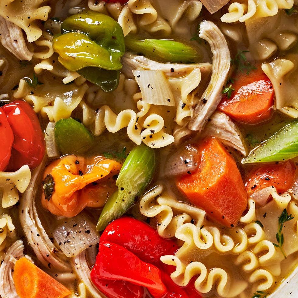 chicken soup with noodles and scotch bonnet peppers