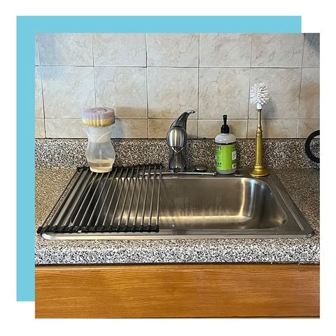 kitchen sink with sponge and soap