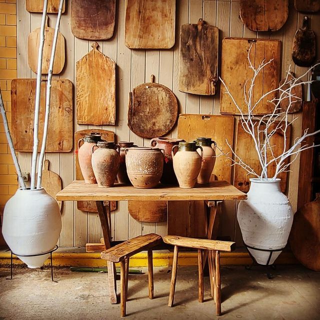 terra cotta vases in front of cuttingboards