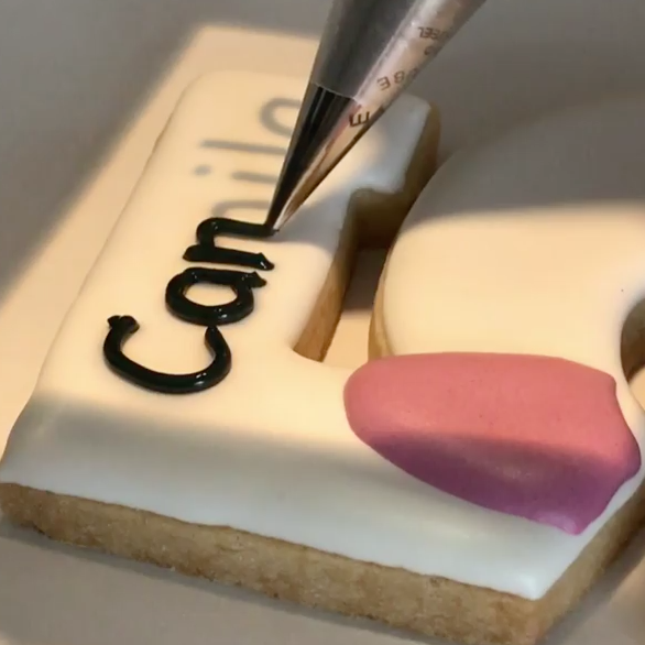 The Brilliant Way this Baker Writes on Cookies with Icing Is So