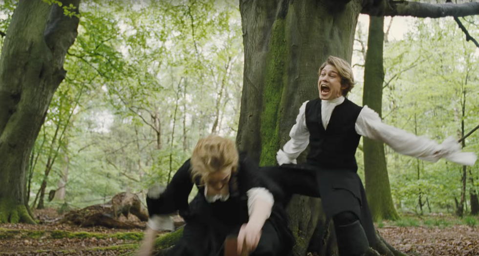 Joe Alwyn in his role as Baron Masham in "The Favourite" surprise-attacks Emma Stone, who plays Abigail Hill