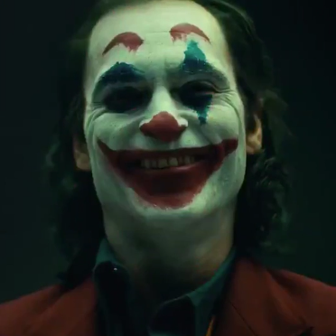 Face, Clown, Joker, Facial expression, Head, Supervillain, Performing arts, Smile, Nose, Fictional character, 