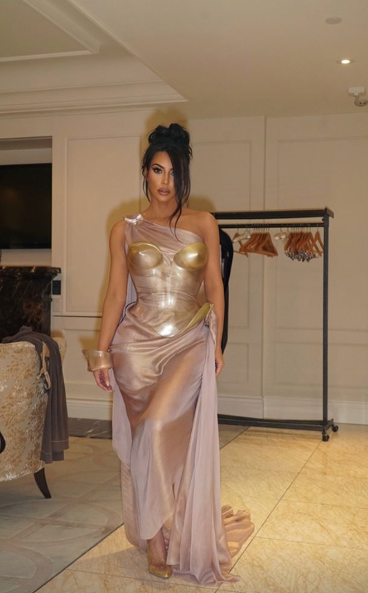 Kim Kardashian Attends Thierry Mugler Exhibition in Grecian