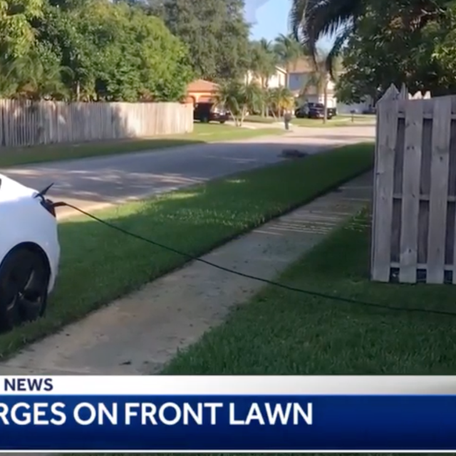 Tesla charging on front lawn