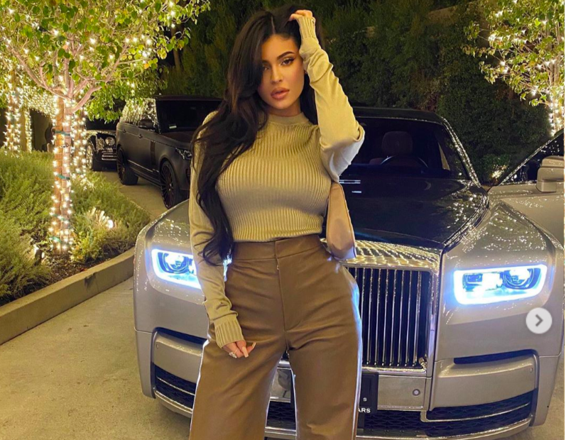 Kylie Jenner shows off postbaby curves in skintight leather pink dress in  racy new ad for cosmetics line  The Sun