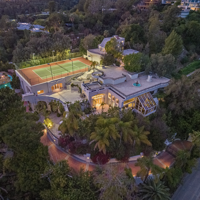 Los Angeles mansion with a tennis court and trees