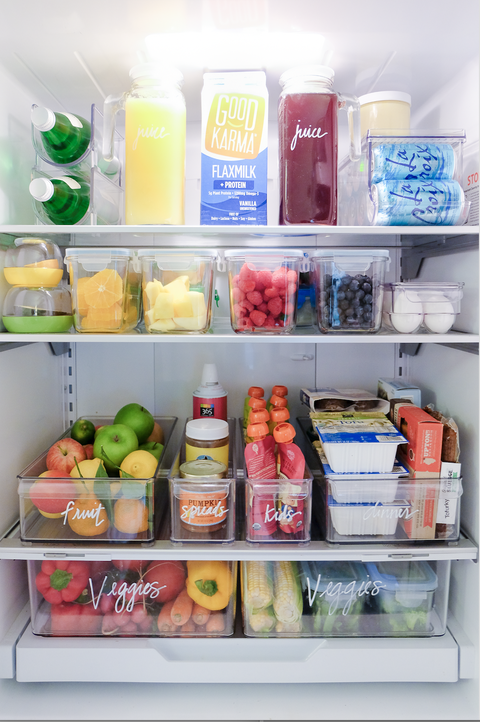 an organized refrigerator by the home edit
