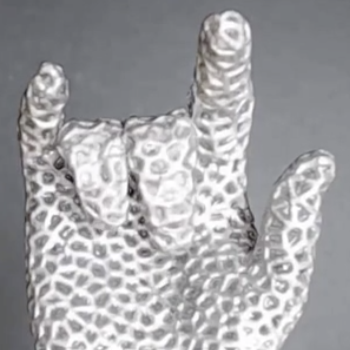 a hand made of white "lattice" material, formed into the "rock 'n' roll" hand position