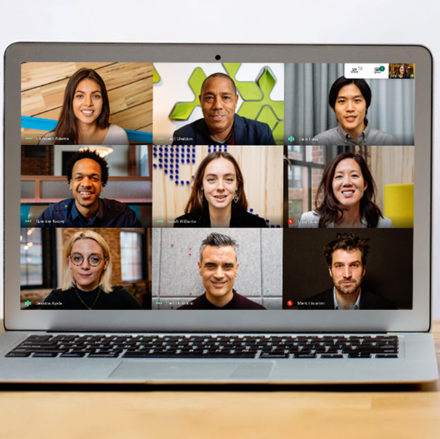 a laptop screen showing a 3 by 3 grid of people video conferencing with google meet