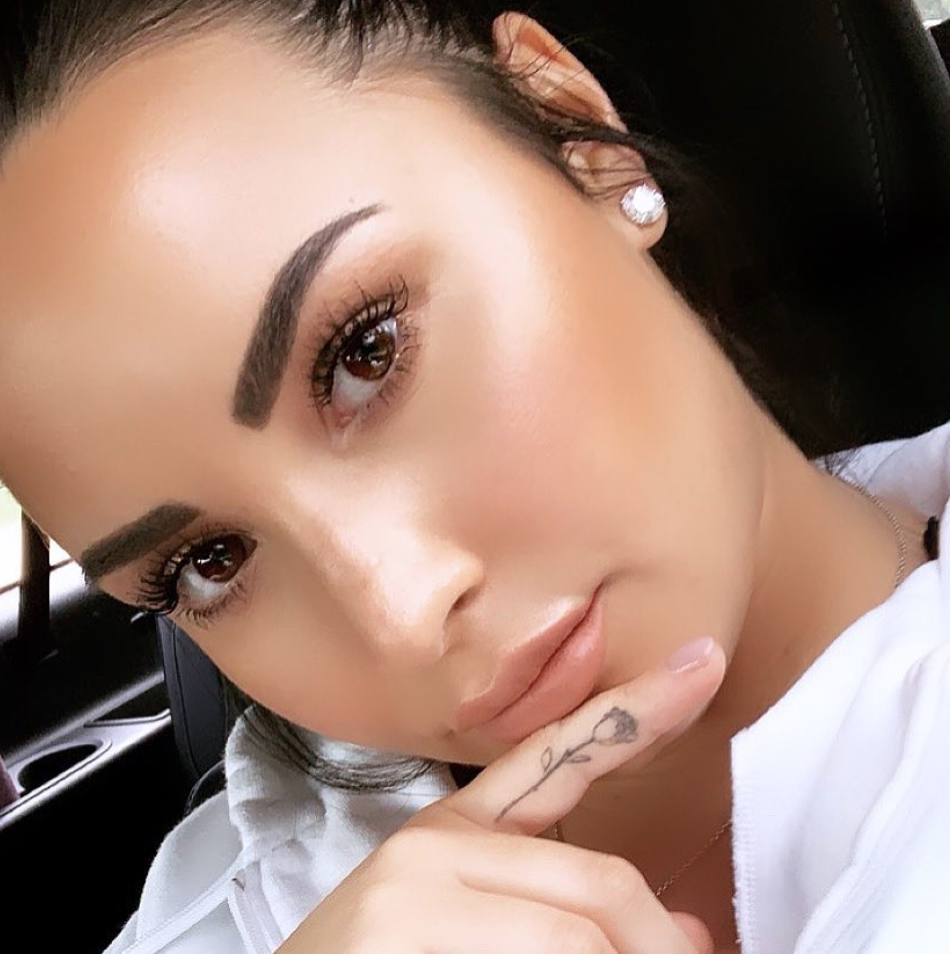 Demi Lovato debuts new butterfly neck tattoo and possible new song lyrics |  Daily Mail Online