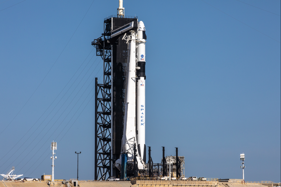 crew dragon capsule and falcon 9 rocket stand poised for flight atop launchpad 39a at nasa's kennedy space center in florida