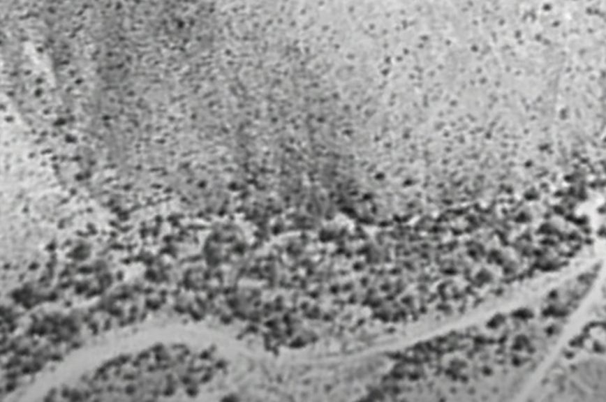 1998 image capture shows desert hills with no visible entrances