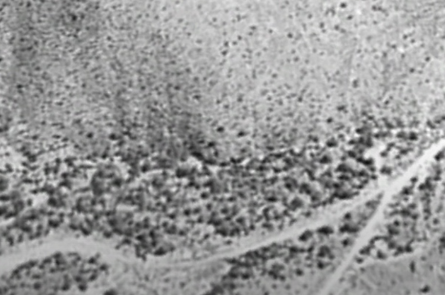 1998 image capture shows desert hills with no visible entrances