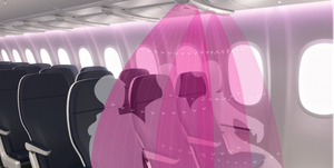 three passengers sit in a row on an airplane air flows directly downward so that potentially harmful particles do not intermix with other passengers