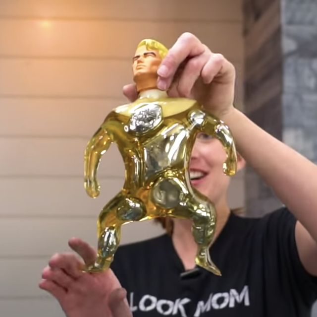 an image of a skinned stretch armstrong doll dotted with large areas of silvery metal liquid