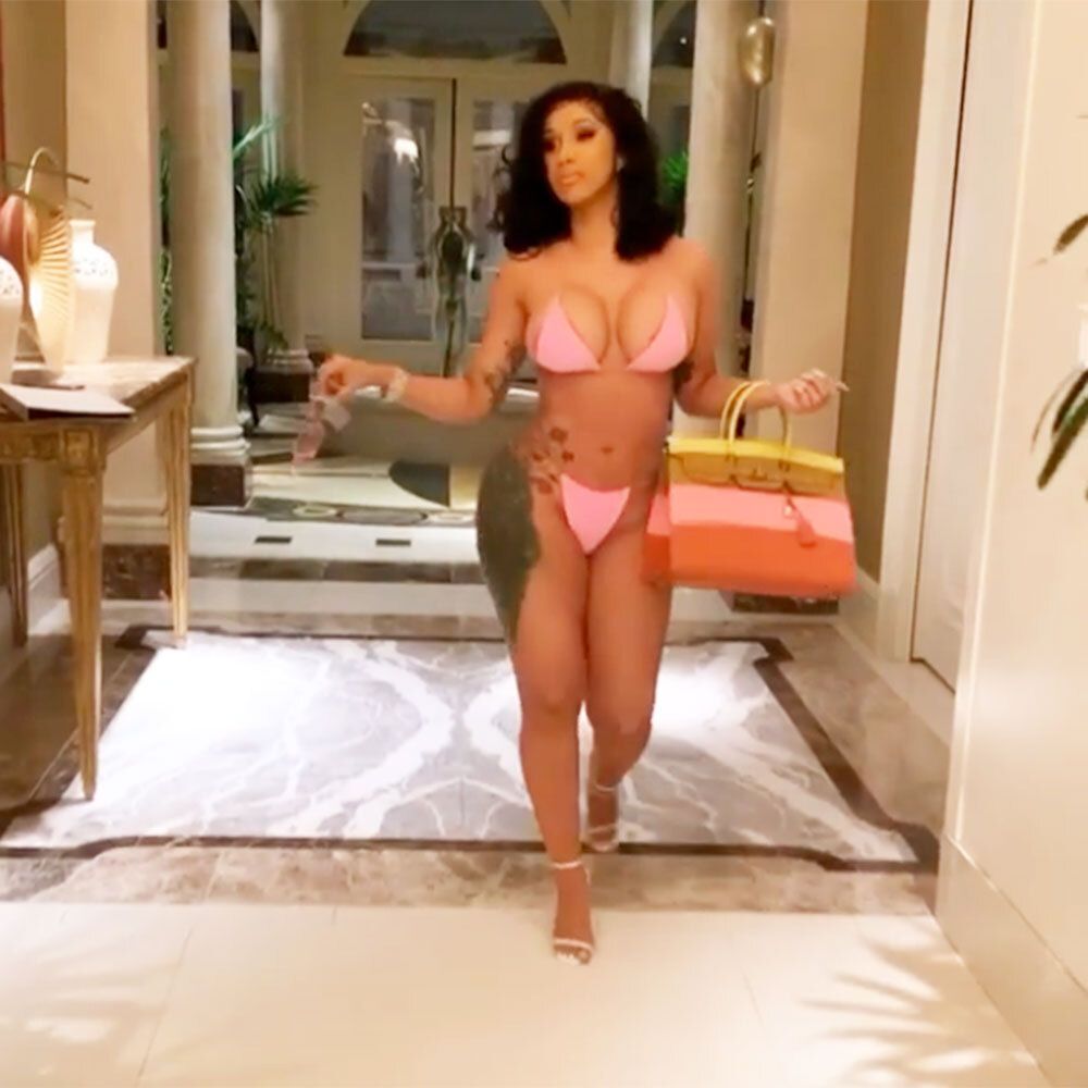 Cardi B flaunts her curves in a pink string bikini as she celebrates 28th  birthday in Las Vegas