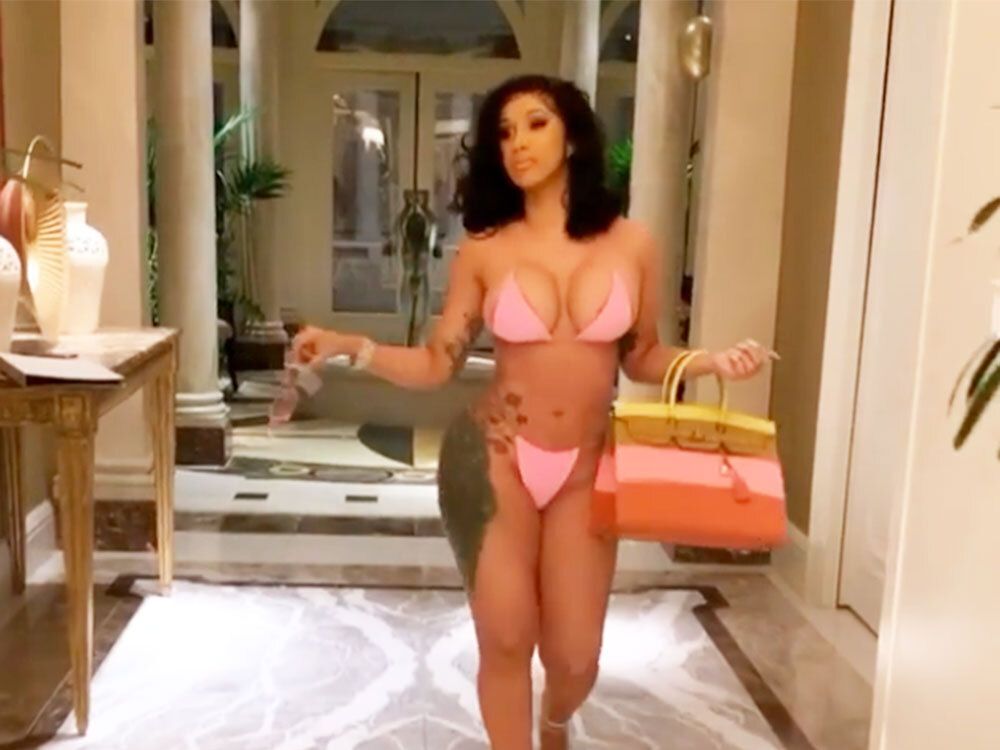 Cardi B flaunts her curves in a pink string bikini as she celebrates 28th  birthday in Las Vegas