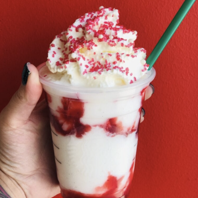 totally the bomb starbucks secret menu santa claus frappuccino, red and white beverage with whipped cream and red sprinkles
