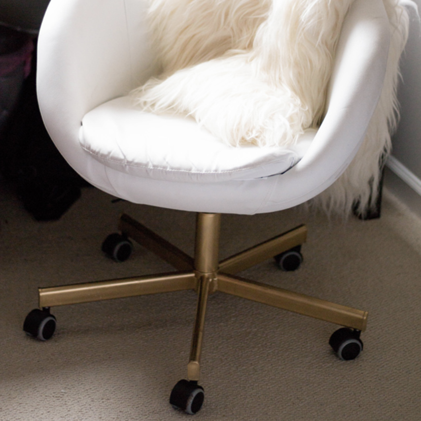 white ikea chair with gold bottom