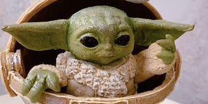 baby yoda gingerbread sculpture using colorful dough and frosting