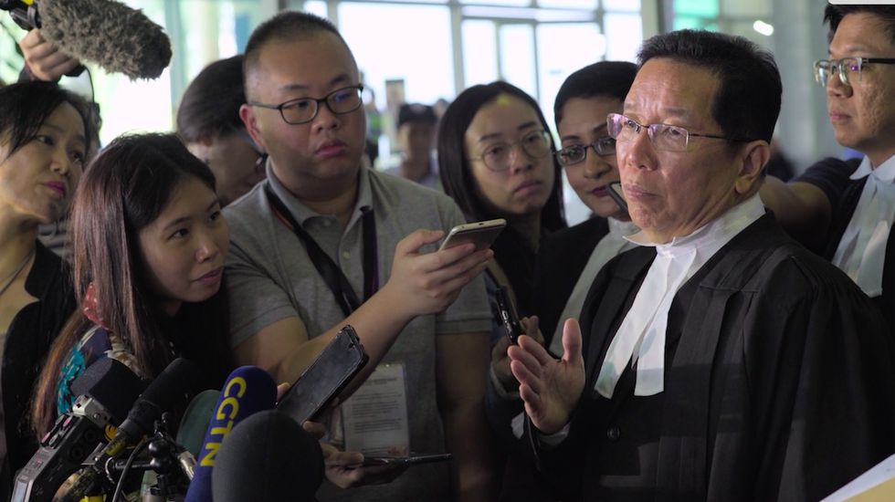 assassins siti aisyah’s lawyer, gooi soon seng, speaking to reporters outside the courthouse
