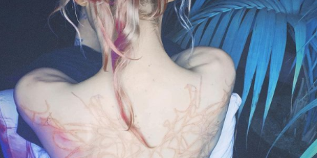 Grimes's Tattoos and Their Meanings