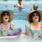 kristen wiig and annie mumolo, two actresses, stand in a pool in a still from barb and star go to vista del mar