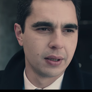 actor max minghella, a white male with black hair, in a still from the handmaid's tale