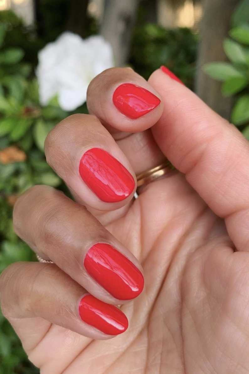 a simple red mani with a floral background