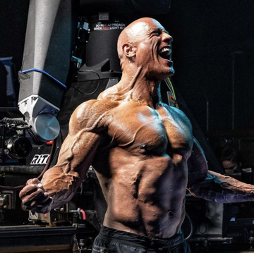 the rock flexing his muscles on the set of black adam
