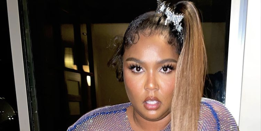 Lizzo shows off her curvaceous behind in a VERY revealing thong workout set