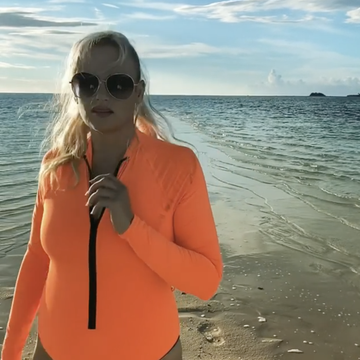 rebel wilson legs neon orange swimsuit instagram video