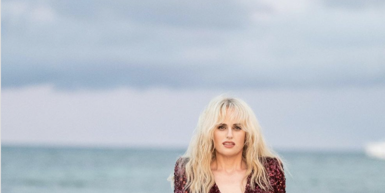 Rebel Wilson, 41, Flashes Toned Legs On The Beach In New IG Pics