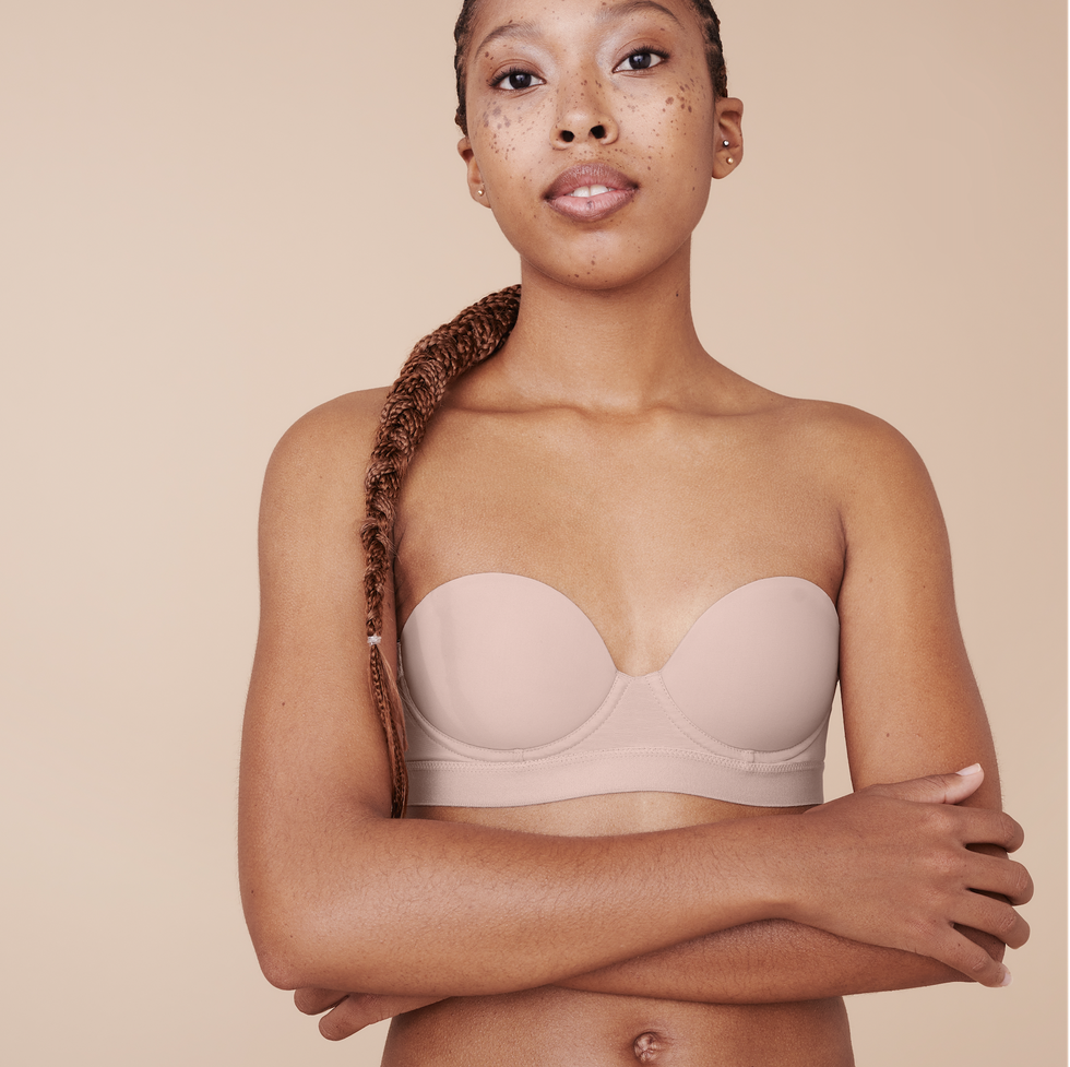 a model wears a pepper strapless bra to illustrate a pepper bra review 2022
