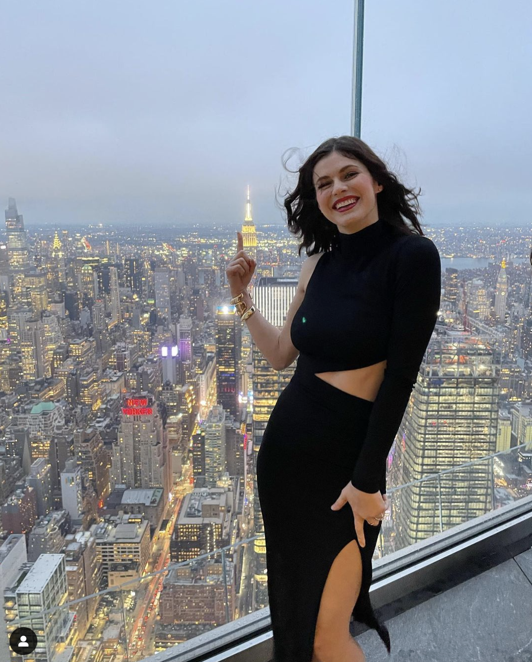 Alexandra Daddario Once Leaned To Put Her B*sty Cl*avage On Display Through  The Plunging Neckline Of A White Monokini & Made Our Jaws Touch The Floor