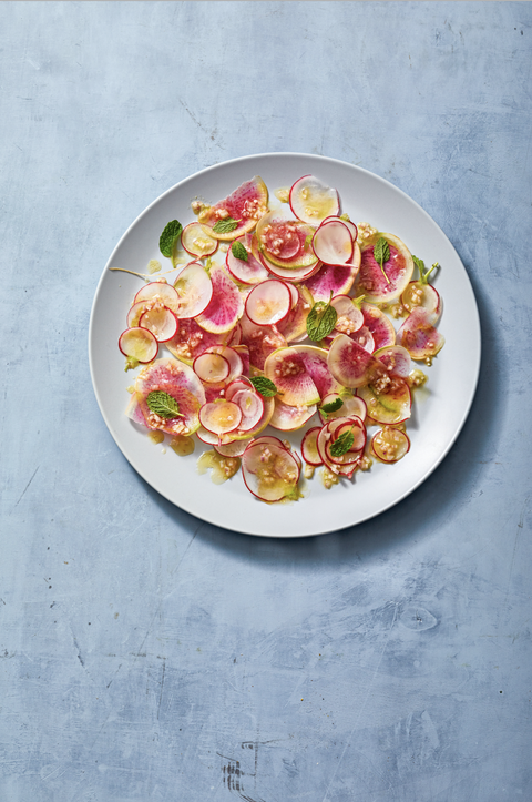 bright radish salad with fresh mint and served on a blue plate