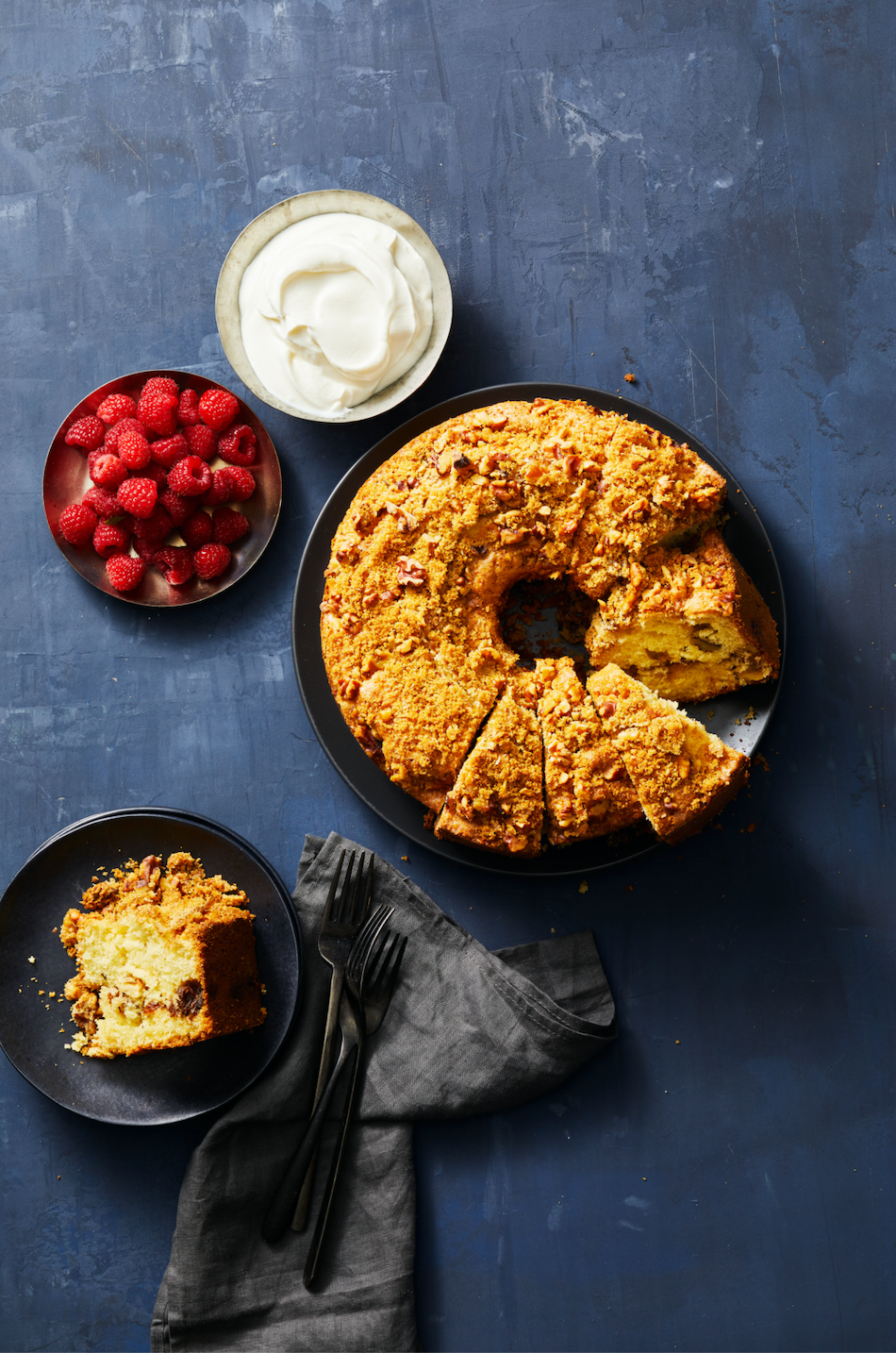 raisin walnut coffee cake with a side of berries and cream