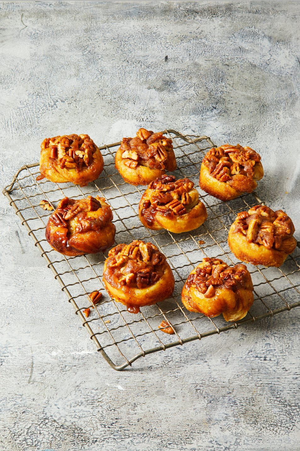 pecan sticky buns on a wire rack