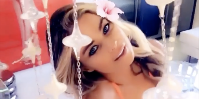 Carmen Electra highlights her hourglass figure in a tight floral