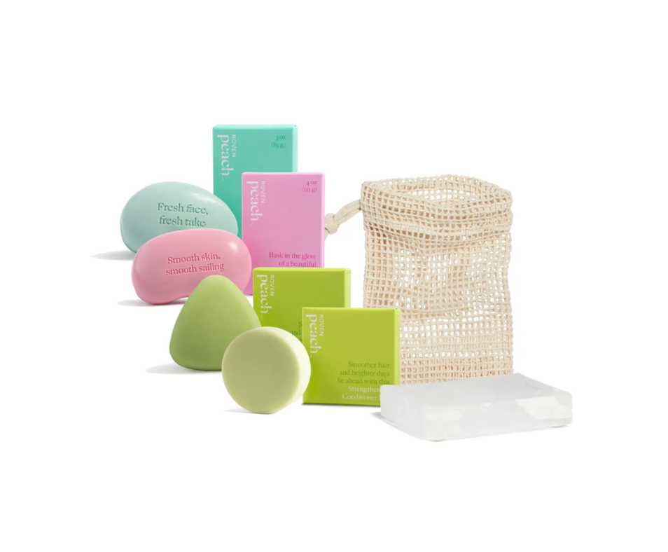 pink and green boxes and bars of grove collaborative bodycare products on a white background