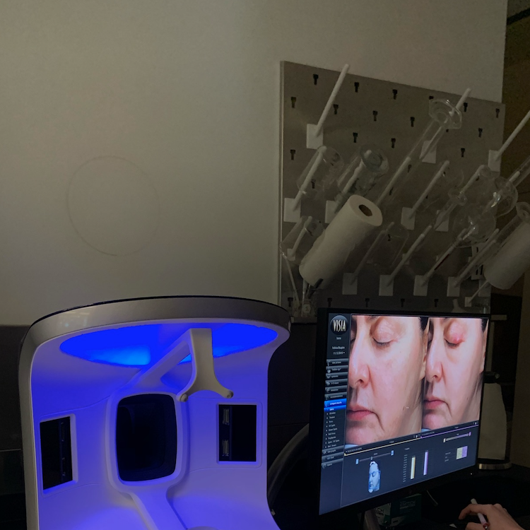 the visia complexion analyzer being used to test skincare products like dark spot correctors in the good housekeeping institute beauty lab