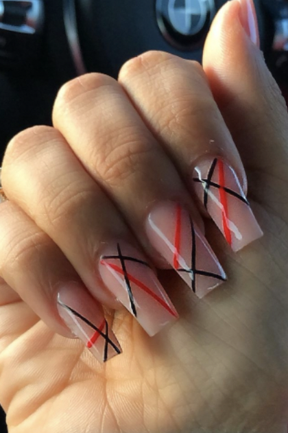 a nude manicure with raised blue and red lines design, featuring a square nail shape