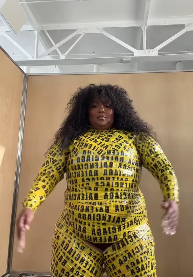 Lizzo Dances to Her Own Song While Wrapped in Balenciaga Caution Tape