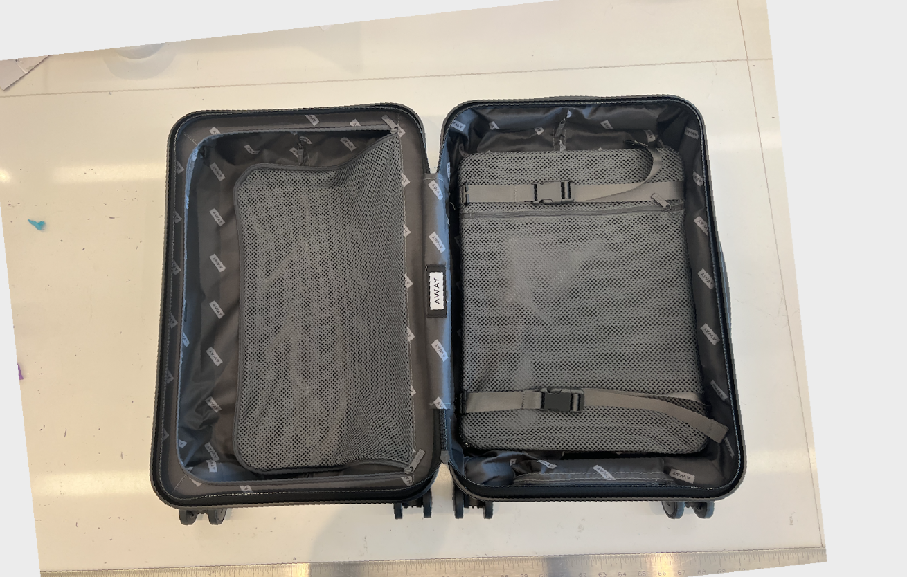 Something Different – Away Luggage Review – 4 Wheels and a Motor