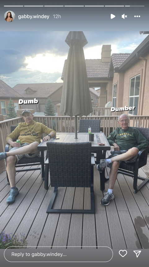two men sitting on a porch