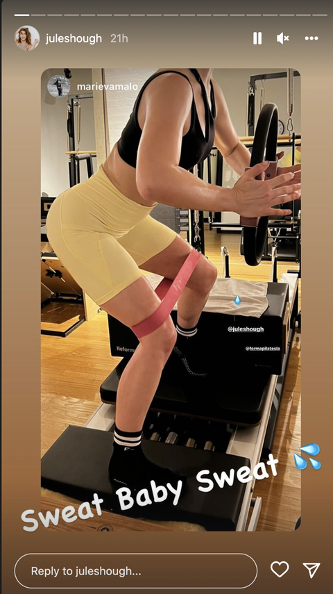 julianne hough working her legs, glutes, arms, and core while using a pilates ring in a reformer class