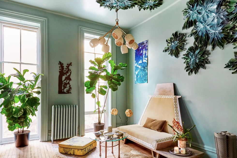 living room ideas, light green living room with greenery installation on the ceiling