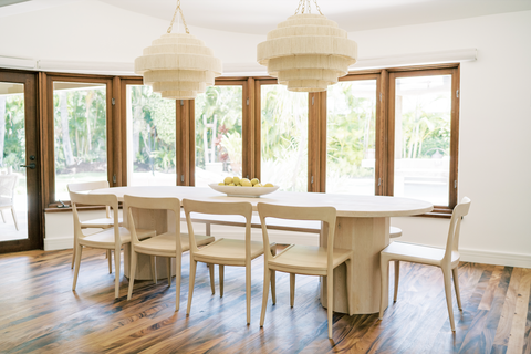 dining room with windows and an oak dining set
